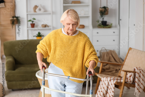 Senior woman using walker a...