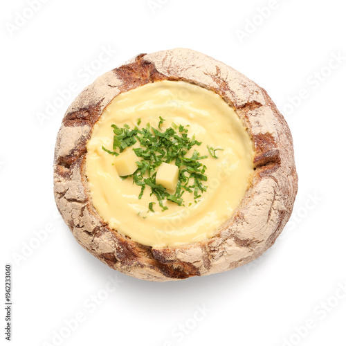 Cheese soup in bread bowl o...