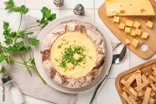 Cheese soup in bread bowl w...
