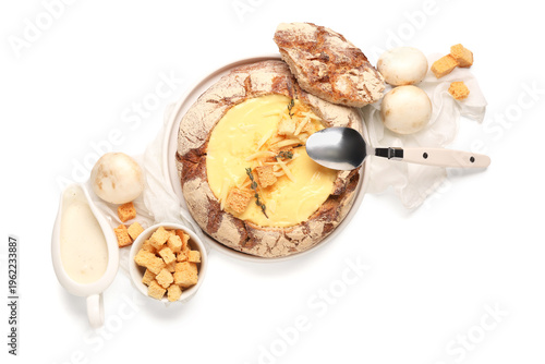 Cheese soup in bread bowl w...
