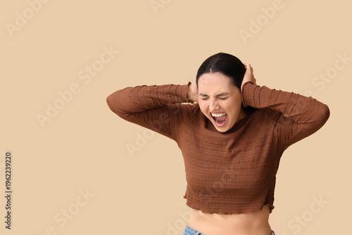 Screaming young woman cover...