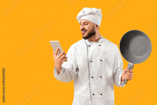 Male chef with tablet compu...