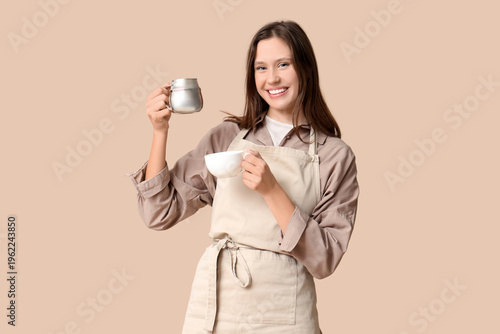Happy young female barista ...