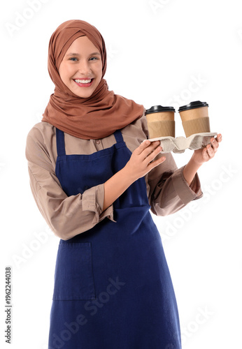 Happy young female barista ...