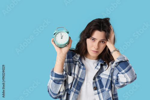 Tired young woman with alar...