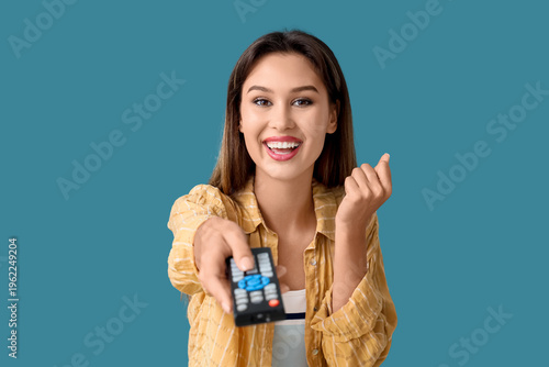 Happy young woman with remo...