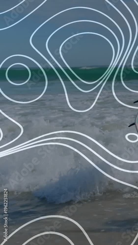 Vertical video: Surfer stepping in surf as waves grow, fixing leash under overlay for surfing