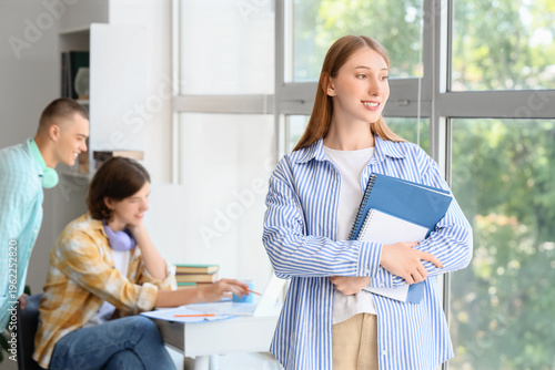 Female student with noteboo...
