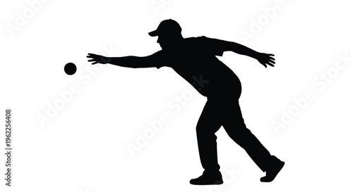 Silhouette of a bowler releasing a bowling ball during a throw