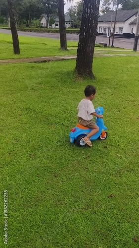 A little boy is playing in the park