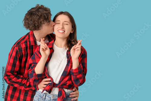 Young man kissing his girlf...