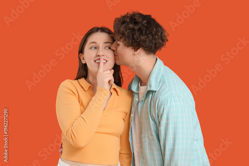 Young man kissing his girlf...