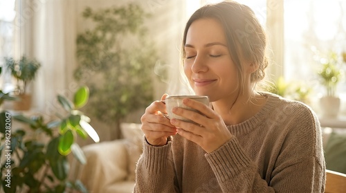 Woman smelling steam from a ceramic cup of hot tea. Morning ritual with beverage in sunlight. Relaxing lifestyle, cozy home interior and mindfulness