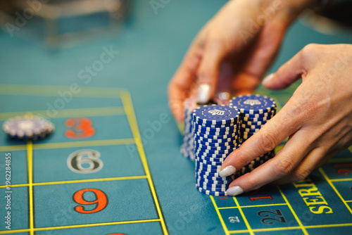 Obraz na plátně Croupier Managing Bets on Roulette Table Close-Up