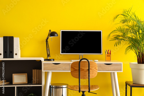 Stylish workplace with mode...