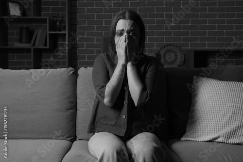 Scared young woman sitting ...