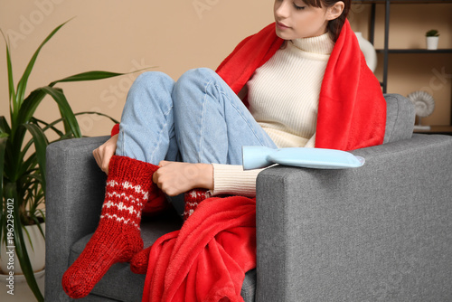 Young woman in warm socks w...
