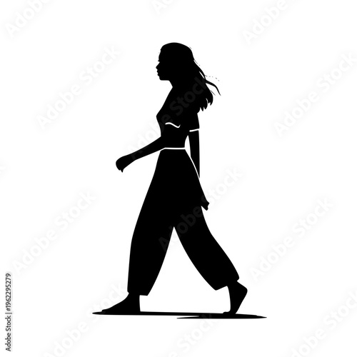 Black silhouette of a woman walking with a dynamic stride and flowing hair