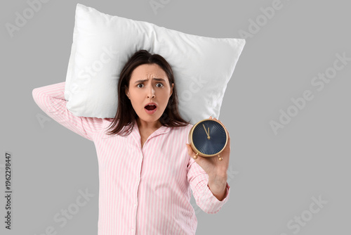 Shocked young woman in stri...