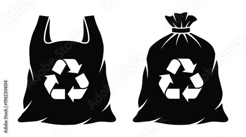 Two black plastic bags with recycling symbols a striking silhouette