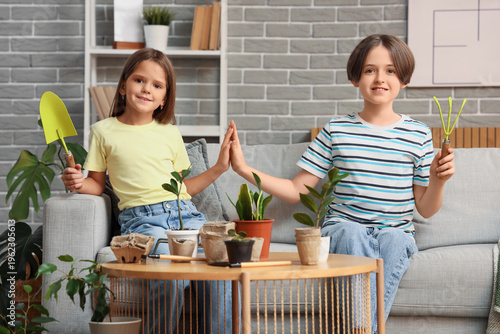 Cute children with gardenin...
