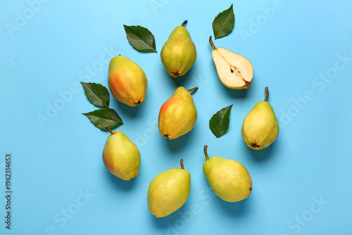 Fresh pears and leaves on b...