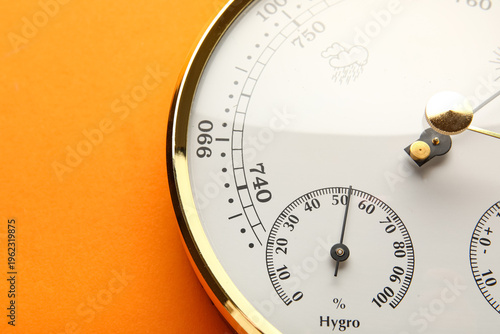 Billede på lærred Aneroid barometer on orange background