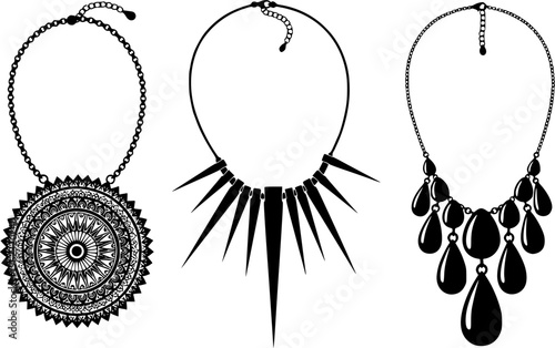 Set of three elegant black silhouette necklaces with intricate ethnic and geometric patterns, minimalist luxury jewelry vector isolated on white.