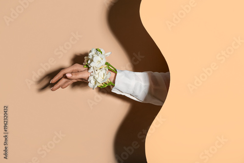 Woman with white flowers on...