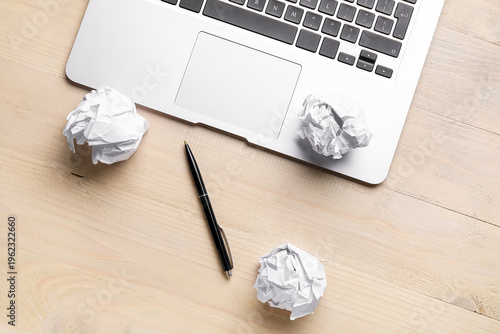 Pen, crumpled paper balls a...