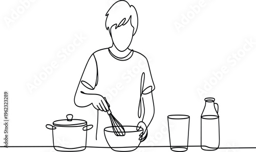 Woman in apron pouring liquid from a pitcher into a pot on a stove cooking kitchen de