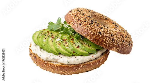 Toasted sesame bagel generously spread with creamy white hummus and layered with fresh green avocado slices, isolated on transparent background for healthy breakfast menus