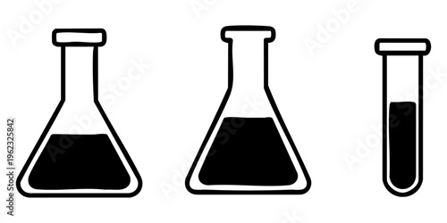 Three laboratory flasks and a test tube filled with dark liquids on a table