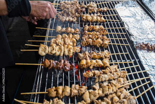 Grilled pork satay on the grill, Thai street food.