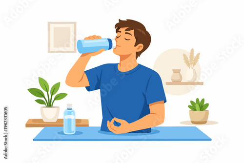 Man drinking water from a bottle on a yoga mat indoors
