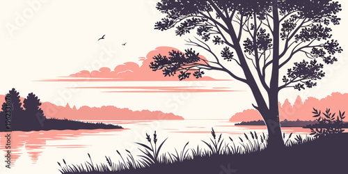 A tree stands by a river at sunset