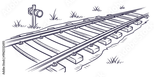 A railroad track with a traffic light on the side