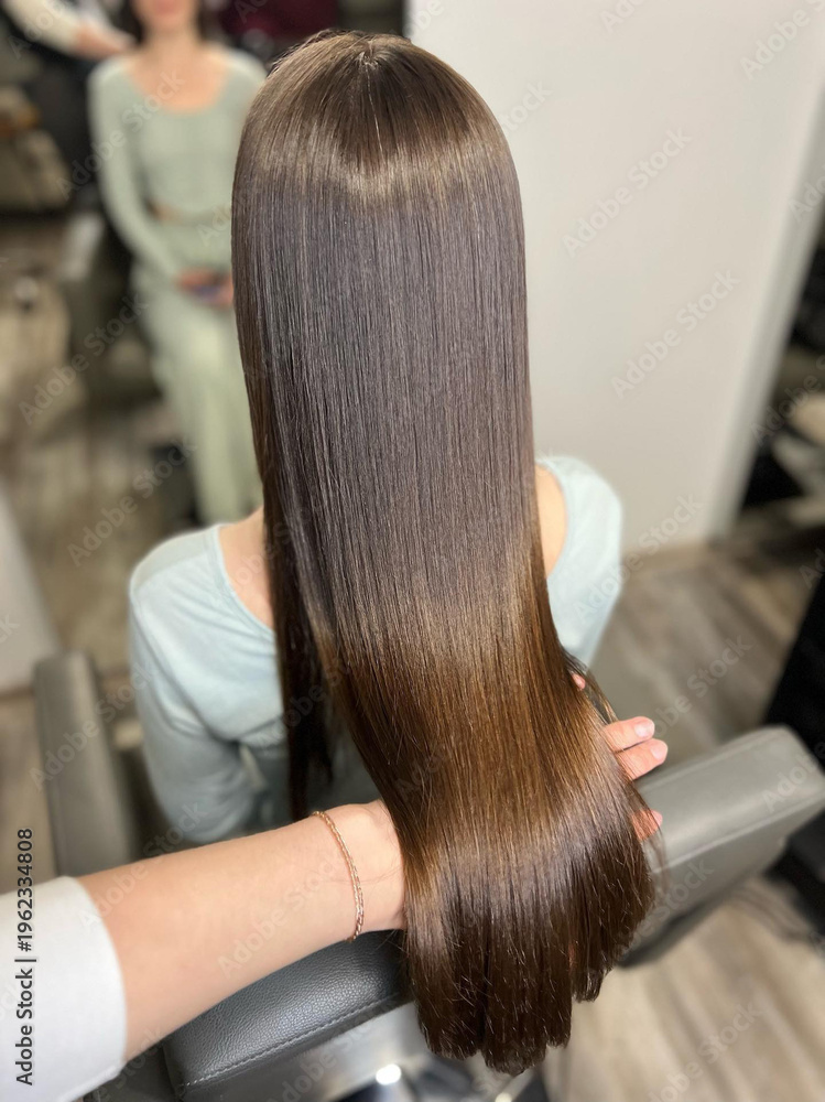 Naklejka premium Hair care concept, silky smooth straight hair after salon keratin procedure