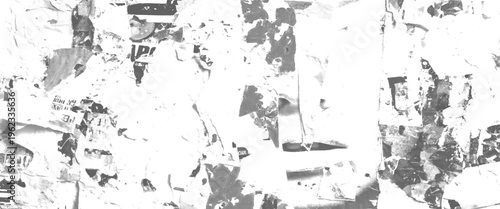 Torn paper posters on wall black and white abstract texture with visible text fragments and peeling layers