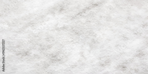 Abstract closeup of fresh white sugar crystals on a white surface creating a textured frost pattern reminiscent of cold winter snow and frozen ice