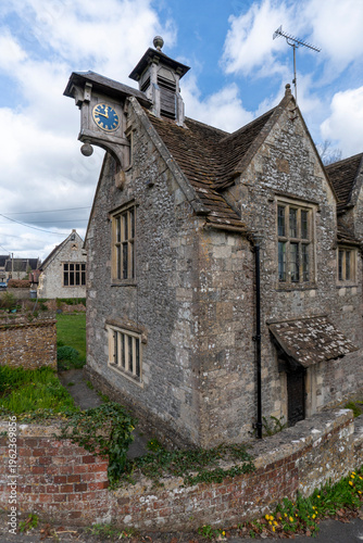 Longbridge Deverill,Wiltshire,UK, 26th March 2026 - Thynne's Almshouses with clock in Longbridge Deverill, Wiltshire