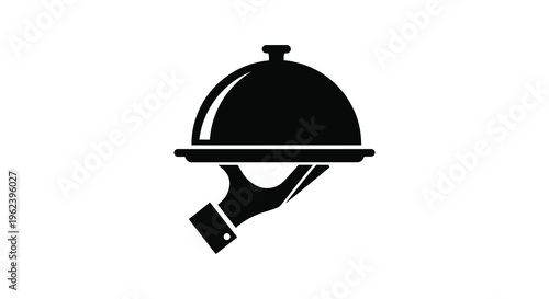 Silhouette of a hand holding a covered serving dish