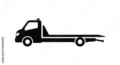 Silhouette of a flatbed tow truck vehicle in black