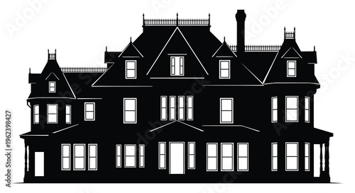 Silhouette of a large victorian style house with multiple gables and chimney