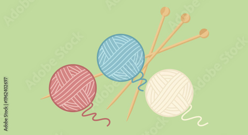 Colorful yarn balls and knitting needles on a table indoors