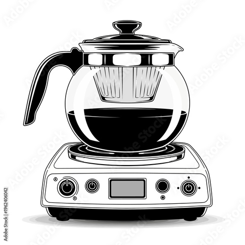 Transparent glass teapot with infuser on electric hot plate, brewing tea