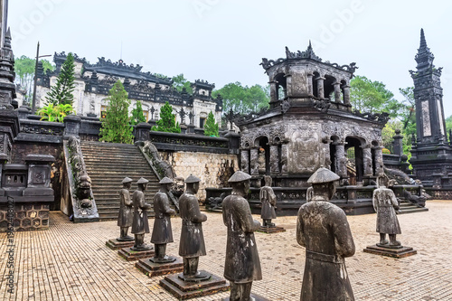 Historic Khai Dinh Tomb near Hue in Vietnam featuring stone statues, ornate imperial architecture and cultural heritage. Famous travel destination and landmark in Southeast Asia.