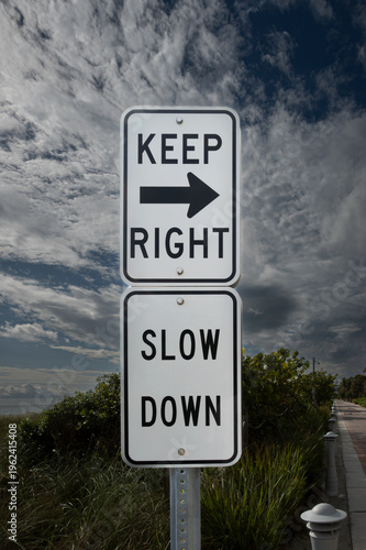 Road sign Keep Right Slow Down - USA