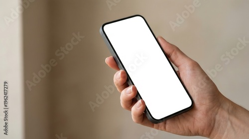 Hand holding smartphone with blank white screen