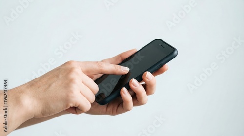 Finger touching smartphone held horizontally close up